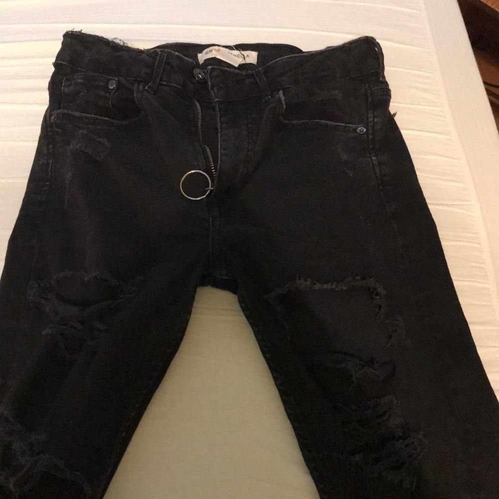 Extremely distressed black high waisted jeans